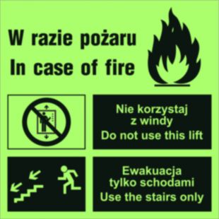 Zakaz korzystania z windy w razie pożaru (lewostronne) - znak ewakuacyjny - AC099