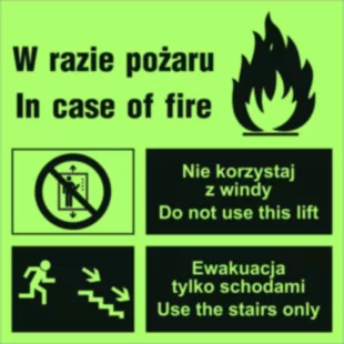 Zakaz korzystania z windy w razie pożaru (prawostronne) - znak ewakuacyjny - AC098