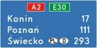 Znak E-14a Znak numeru drogi i odległości od miejscowości - drogowy kierunku miejscowości