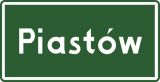 Znak E-17a Znak miejscowości - drogowy kierunku miejscowości - Znak miejscowości E-17a a ograniczenie prędkości