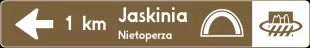 Znak E-22b Drogowskaz prostokątny do zabytku - drogowy kierunku miejscowości