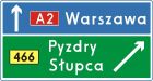Znak E-2c Drogowskaz tablicowy umieszczany obok jezdni na autostradzie - drogowy kierunku miejscowości