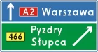 Znak E-2c Drogowskaz tablicowy umieszczany obok jezdni na autostradzie - drogowy kierunku miejscowości