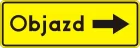 Znak F-9b Kierunek ruchu objazdu opisany na znaku - drogowy uzupełniający